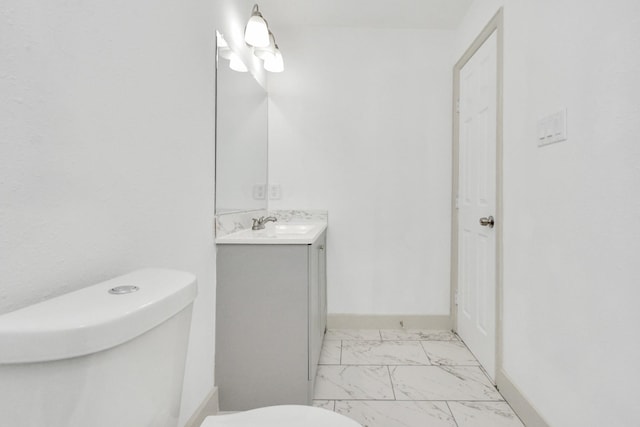 1501 Maiden Ln, Richmond, TX 77469 - bathroom featuring marble finish floor, vanity, toilet, and baseboards