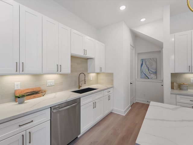 kitchen with stainless steel dishwasher, baseboards, recessed lighting, tasteful backsplash, and a sink