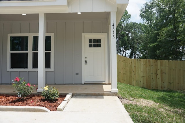 14848 Lamar Rd, Willis, TX 77378 - entrance to property with fence and board and batten siding