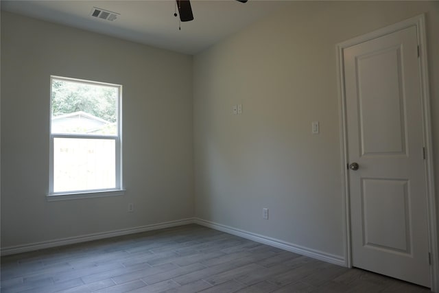 14848 Lamar Rd, Willis, TX 77378 - spare room with a ceiling fan, baseboards, visible vents, and wood finished floors