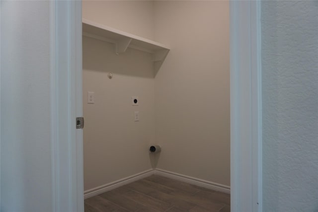14848 Lamar Rd, Willis, TX 77378 - clothes washing area with baseboards, dark wood-style flooring, laundry area, and electric dryer hookup