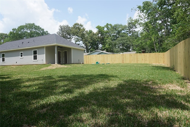 14848 Lamar Rd, Willis, TX 77378 - view of yard featuring a fenced backyard and ceiling fan