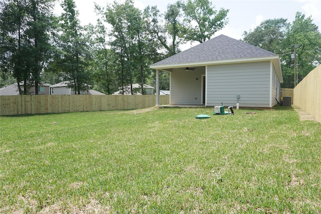 14848 Lamar Rd, Willis, TX 77378 - view of yard featuring central AC, a ceiling fan, and a fenced backyard