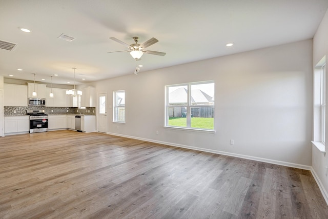 unfurnished living room featuring recessed lighting, a ceiling fan, light wood finished floors, and visible vents