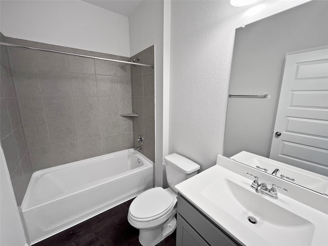 1907 Temple Grove Dr, Iowa Colony, TX 77583 - bathroom featuring toilet, vanity, shower / tub combination, and a textured wall