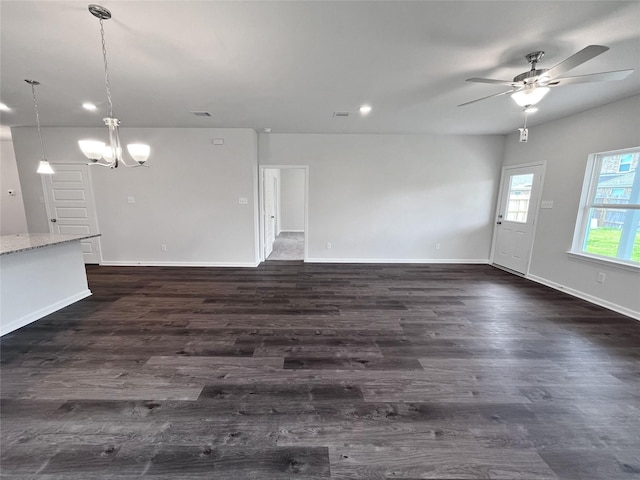 1907 Temple Grove Dr, Iowa Colony, TX 77583 - unfurnished living room featuring ceiling fan, a chandelier, dark wood finished floors, baseboards, and recessed lighting