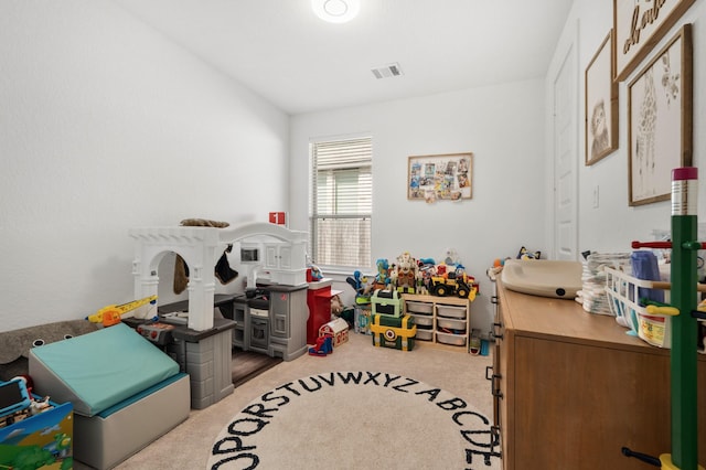 rec room with visible vents and carpet