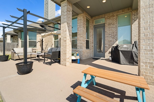 view of patio / terrace with an outdoor hangout area, fence, area for grilling, and a pergola