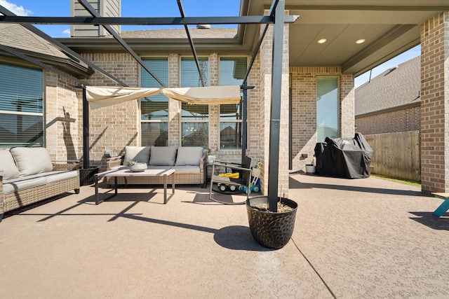 view of patio / terrace featuring an outdoor hangout area, a grill, and fence