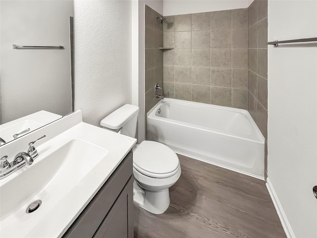 1826 Temple Grove Dr, Iowa Colony, TX 77583 - bathroom featuring toilet, wood finished floors, vanity, and washtub / shower combination