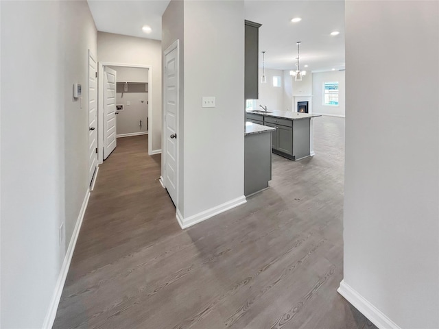 1826 Temple Grove Dr, Iowa Colony, TX 77583 - hall with a sink, baseboards, wood finished floors, and recessed lighting