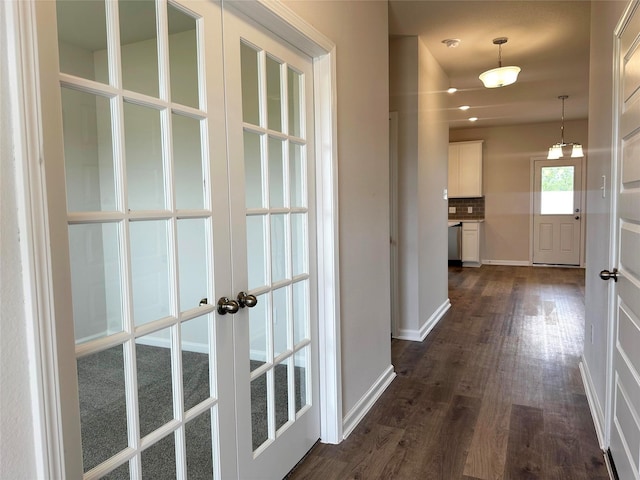 755 Red Mulberry St, La Marque, TX 77568 - corridor featuring french doors and dark wood-type flooring