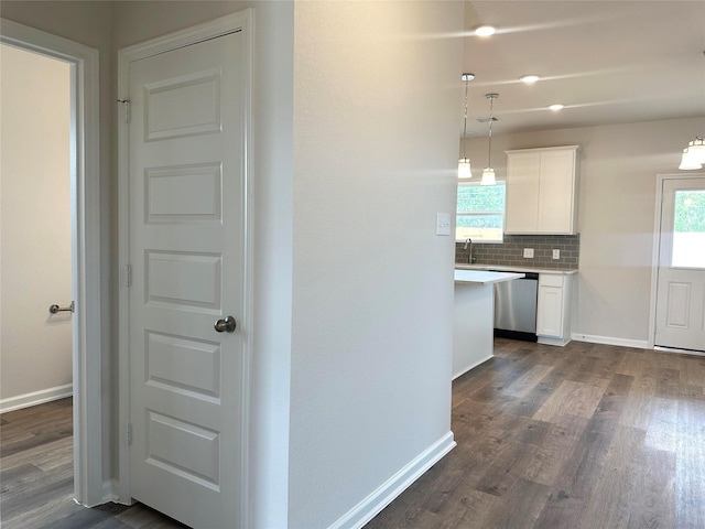755 Red Mulberry St, La Marque, TX 77568 - hallway featuring dark wood-style flooring and healthy amount of natural light