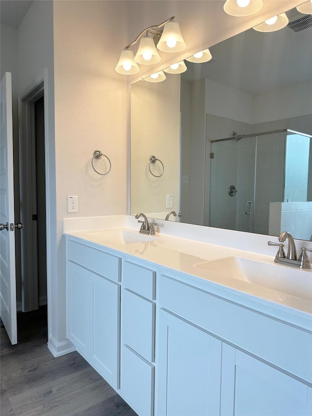 755 Red Mulberry St, La Marque, TX 77568 - full bath with a shower stall, wood finished floors, and double vanity