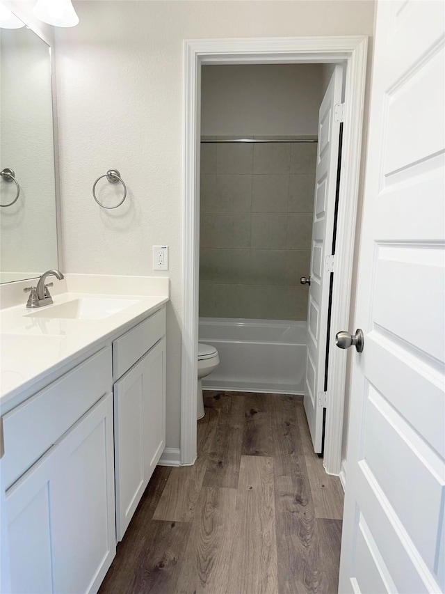755 Red Mulberry St, La Marque, TX 77568 - bathroom with double vanity, wood finished floors, and bathtub / shower combination