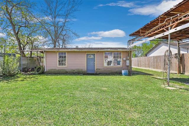 13022 Gladden Dr, Houston, TX 77049 - back of house featuring fence and a yard