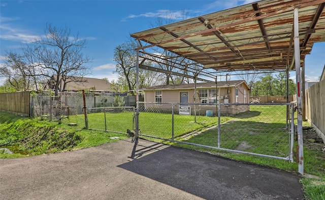 13022 Gladden Dr, Houston, TX 77049 - exterior space featuring a gate, a carport, and fence