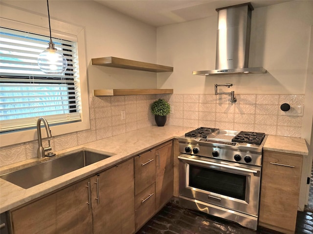 kitchen featuring wall chimney exhaust hood, tasteful backsplash, open shelves, stainless steel stove, and a sink