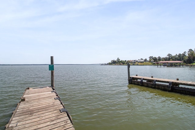 view of dock with a water view