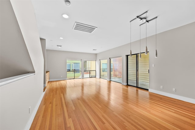 4406 Spencer St Unit A, Houston, TX 77007 - spare room with baseboards, light wood finished floors, recessed lighting, and a smoke detector