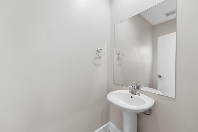 4406 Spencer St Unit A, Houston, TX 77007 - bathroom with a sink and baseboards