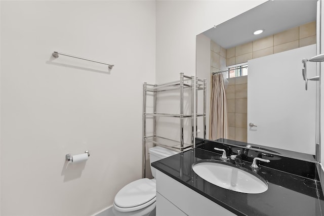 4406 Spencer St Unit A, Houston, TX 77007 - bathroom featuring toilet, vanity, a shower with shower curtain, and baseboards