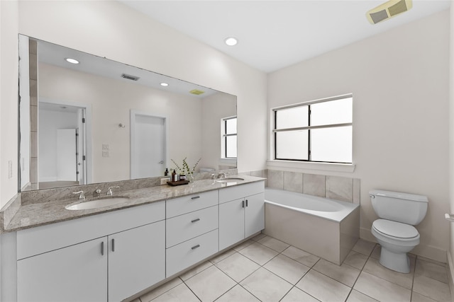 4406 Spencer St Unit A, Houston, TX 77007 - full bathroom featuring toilet, a bath, double vanity, tile patterned flooring, and recessed lighting