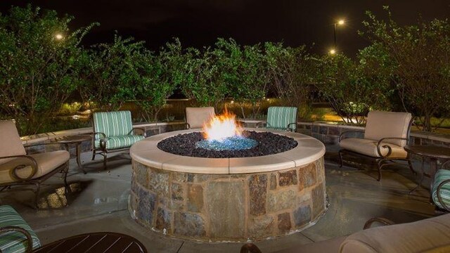 28810 Copper Ridge Dr, Fulshear, TX 77441 - patio at twilight featuring a fire pit and a patio area