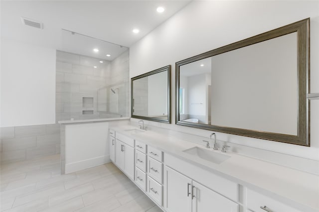 1559 River Point Dr, Friendswood, TX 77546 - bathroom with double vanity, a walk in shower, recessed lighting, and tile patterned flooring
