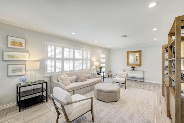 2227 Hialeah Dr, Houston, TX 77018 - living area with light wood-style flooring, visible vents, baseboards, ornamental molding, and recessed lighting