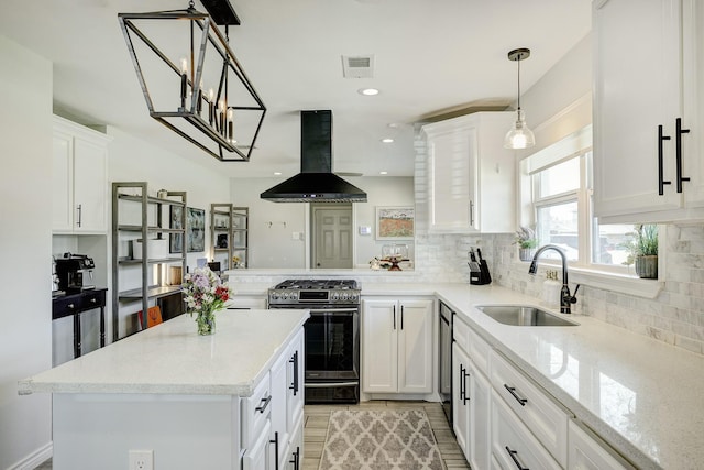 2227 Hialeah Dr, Houston, TX 77018 - kitchen featuring backsplash, a sink, visible vents, gas stove, and island range hood