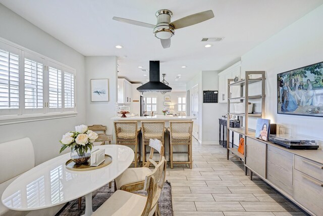 2227 Hialeah Dr, Houston, TX 77018 - dining room featuring recessed lighting, baseboards, visible vents, a ceiling fan, and wood tiled floor