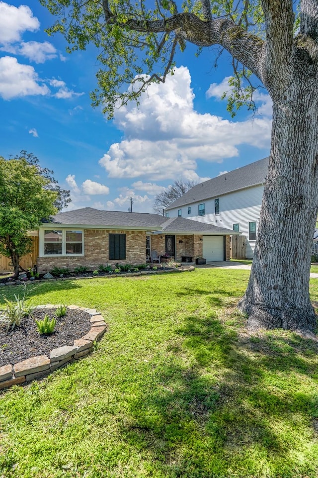 2007 Lamonte Ln, Houston, TX 77018 - back of house with a garage, brick siding, fence, and a yard