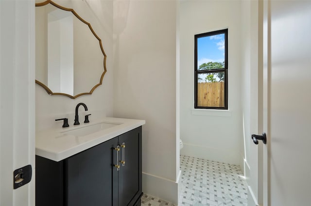 1905 Norcrest Dr, Houston, TX 77055 - bathroom with vanity, tile patterned floors, toilet, and baseboards