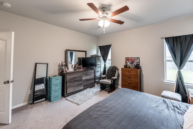 25843 Hickory Pecan Trl, Tomball, TX 77375 - bedroom with light carpet, ceiling fan, and baseboards