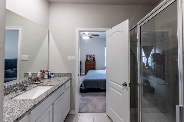 25843 Hickory Pecan Trl, Tomball, TX 77375 - ensuite bathroom featuring ceiling fan, a stall shower, tile patterned flooring, and vanity