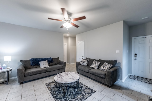 25843 Hickory Pecan Trl, Tomball, TX 77375 - living room with ceiling fan, light tile patterned floors, and baseboards