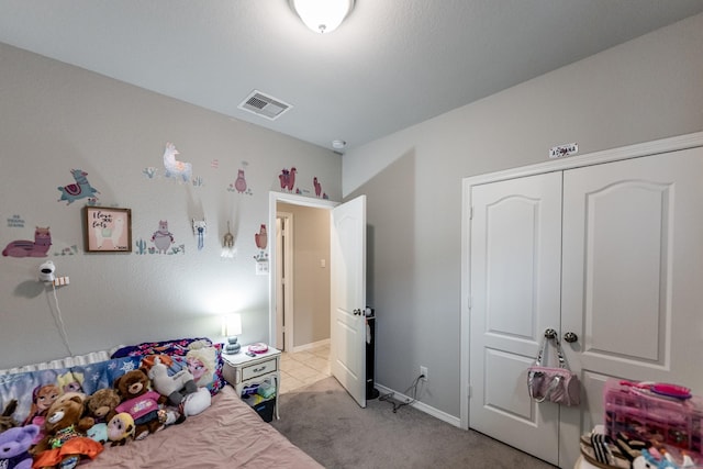 25843 Hickory Pecan Trl, Tomball, TX 77375 - bedroom featuring light carpet, baseboards, and a closet