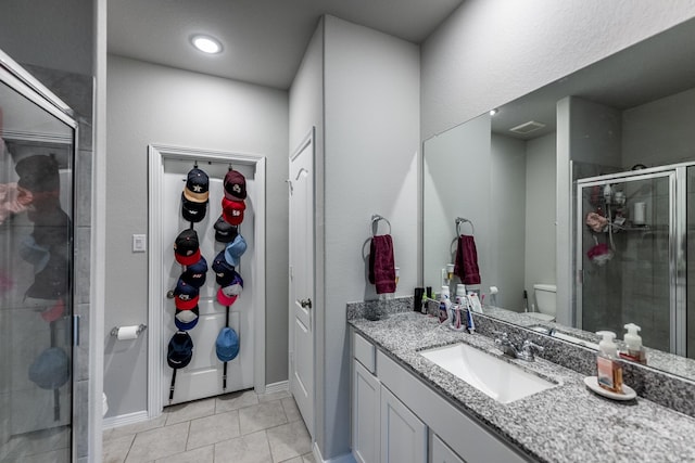 25843 Hickory Pecan Trl, Tomball, TX 77375 - full bath with toilet, a shower stall, vanity, tile patterned floors, and baseboards