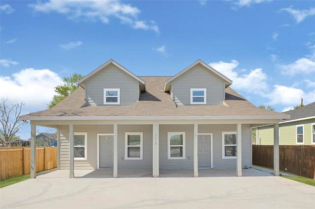 13218 Hp Johnson St A/B, Unit A/B Kendleton, TX 77451 - view of front of house featuring a shingled roof, fence, and a porch