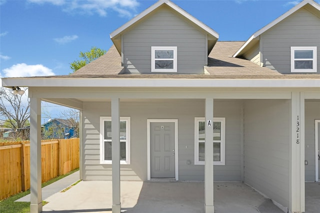 13218 Hp Johnson St A/B, Unit A/B Kendleton, TX 77451 - back of property with fence and roof with shingles