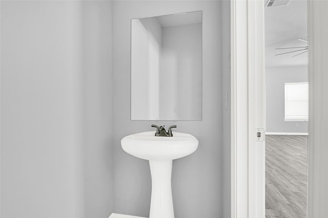 13218 Hp Johnson St A/B, Unit A/B Kendleton, TX 77451 - bathroom featuring baseboards, visible vents, and wood finished floors