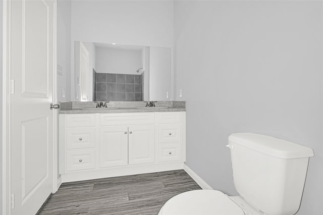 13218 Hp Johnson St A/B, Unit A/B Kendleton, TX 77451 - full bath with double vanity, wood finished floors, toilet, and a sink