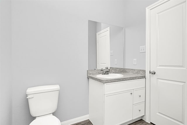 13218 Hp Johnson St A/B, Unit A/B Kendleton, TX 77451 - bathroom featuring baseboards, wood finished floors, toilet, and vanity