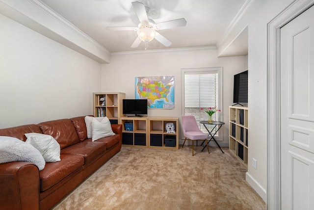 living area with a ceiling fan, ornamental molding, and carpet