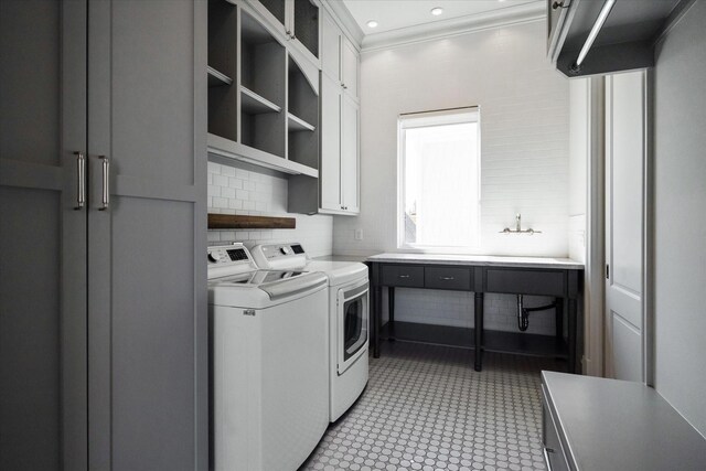 2222 Oxford St, Houston, TX 77008 - washroom with recessed lighting, washer and dryer, cabinet space, and ornamental molding