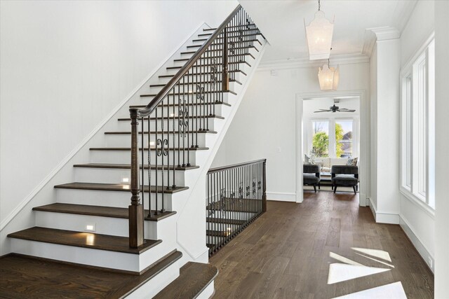 2222 Oxford St, Houston, TX 77008 - staircase with baseboards, ornamental molding, wood finished floors, and an inviting chandelier