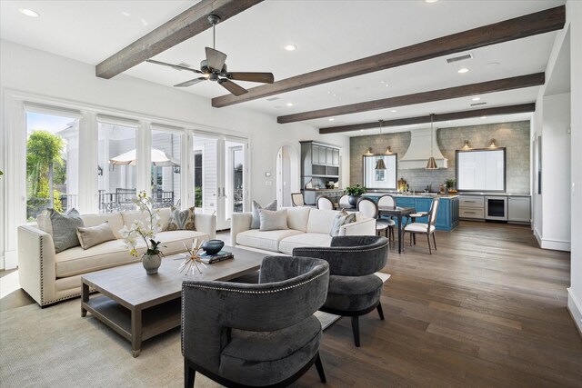 2222 Oxford St, Houston, TX 77008 - living room with wood finished floors, beamed ceiling, arched walkways, ceiling fan, and recessed lighting