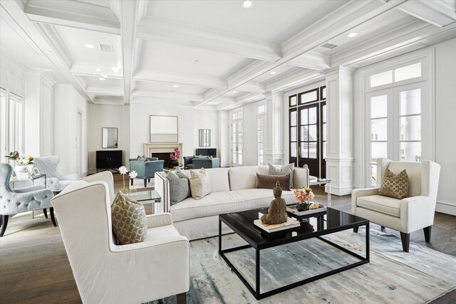 2222 Oxford St, Houston, TX 77008 - living area featuring beamed ceiling, a fireplace, wood finished floors, and decorative columns