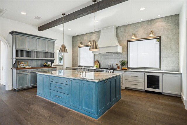2222 Oxford St, Houston, TX 77008 - kitchen with visible vents, beamed ceiling, wine cooler, dark wood finished floors, and custom range hood